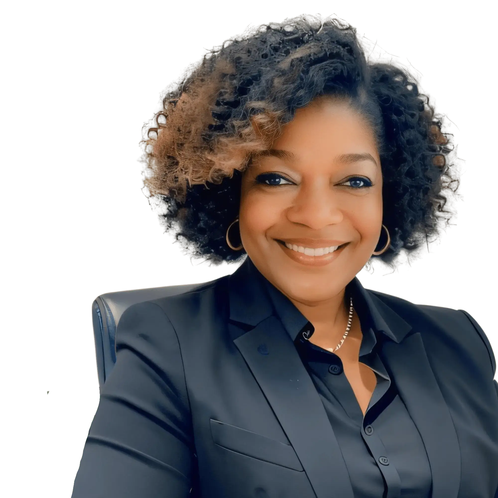 Smiling woman in black blazer, seated.